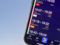Telefon wyświetla rozkład jazdy pociągów z informacją o opóźnieniach.