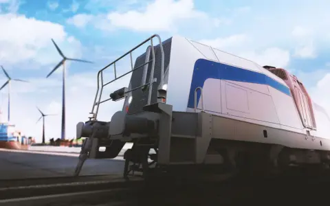 Nowoczesna lokomotywa na wodór gotowa do podróży, z wiatrakami w tle symbolizującymi czystą energię.